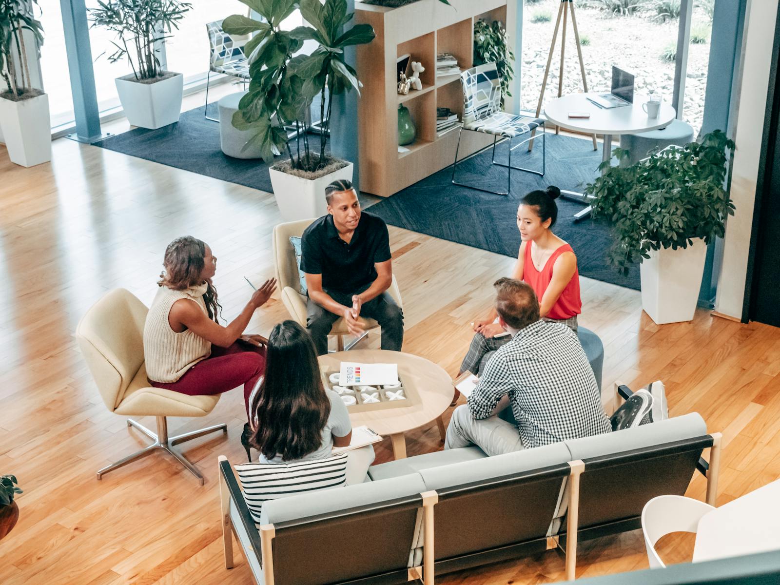 General Liability, A diverse group of professionals engage in a collaborative team meeting in a stylish office environment.